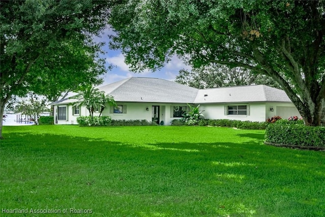 130 Deanna Dr, Lake Placid, FL 33852 - view of front of home with a front lawn and a garage