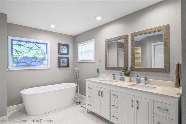 130 Deanna Dr, Lake Placid, FL 33852 - full bath with double vanity, a soaking tub, and tile patterned flooring