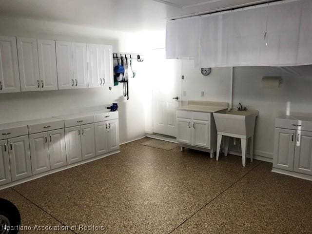 3929 Puma Dr, Avon Park, FL 33825 - interior space with white cabinets and light countertops