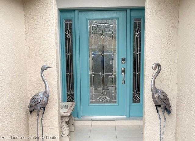 3929 Puma Dr, Avon Park, FL 33825 - entrance to property featuring stucco siding