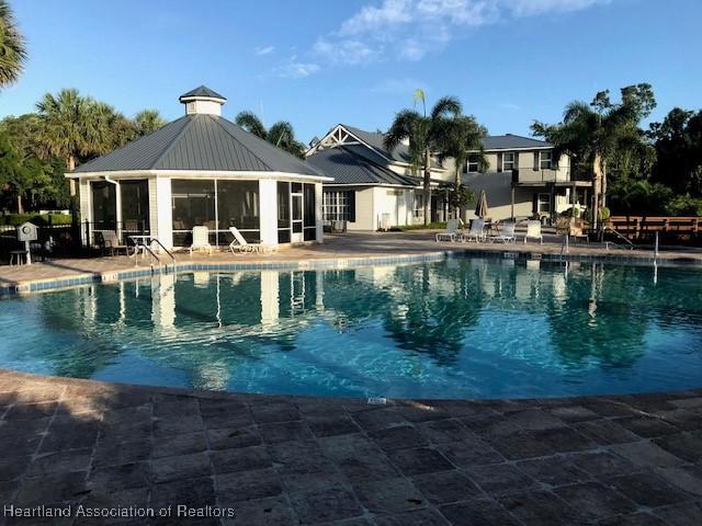 3929 Puma Dr, Avon Park, FL 33825 - community pool with a patio
