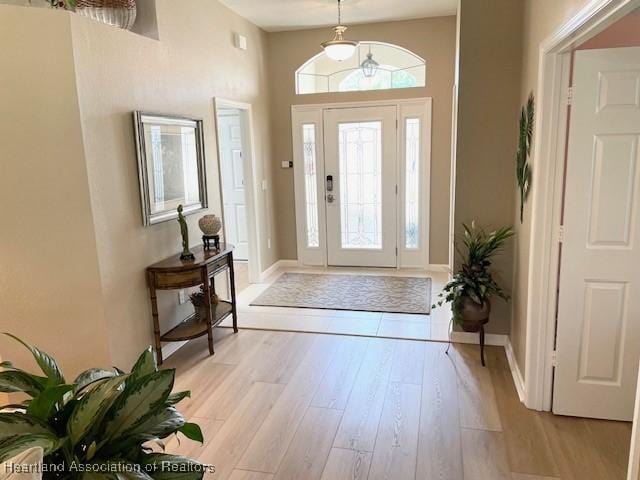 3929 Puma Dr, Avon Park, FL 33825 - entrance foyer featuring light wood-style flooring and baseboards
