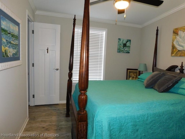 bedroom with crown molding, wood-type flooring, and ceiling fan