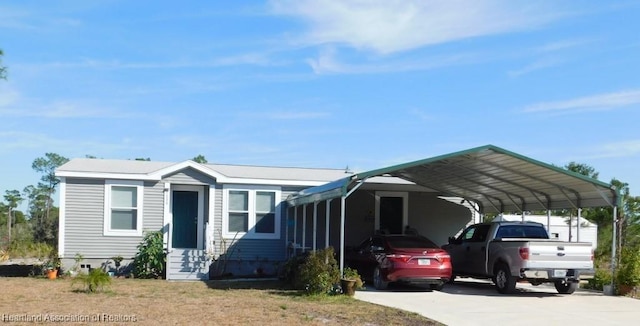 view of front of home featuring a carport