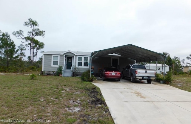 view of front facade with a front lawn and a carport