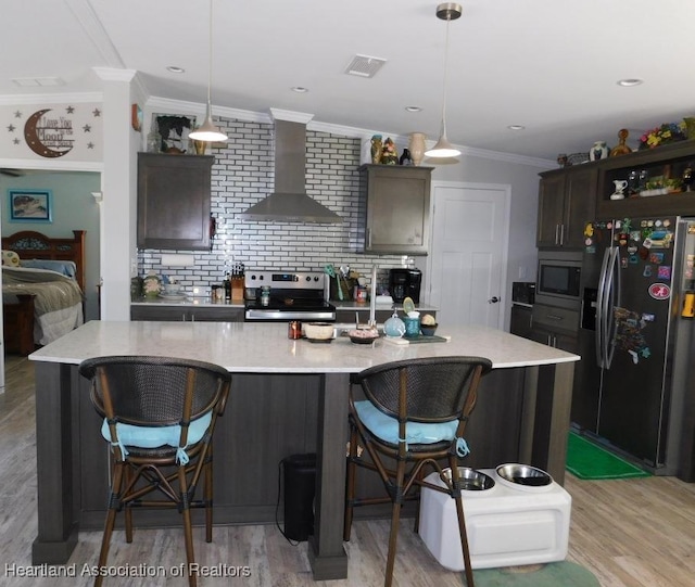 kitchen featuring a large island, pendant lighting, and appliances with stainless steel finishes