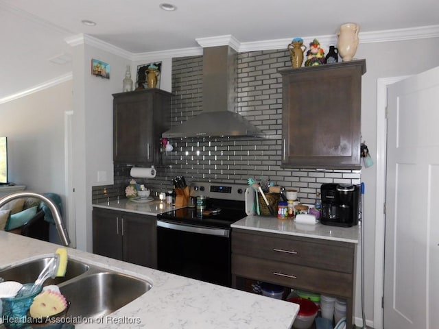 kitchen featuring sink, crown molding, stainless steel range with electric stovetop, decorative backsplash, and wall chimney range hood