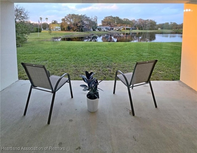 view of patio featuring a water view