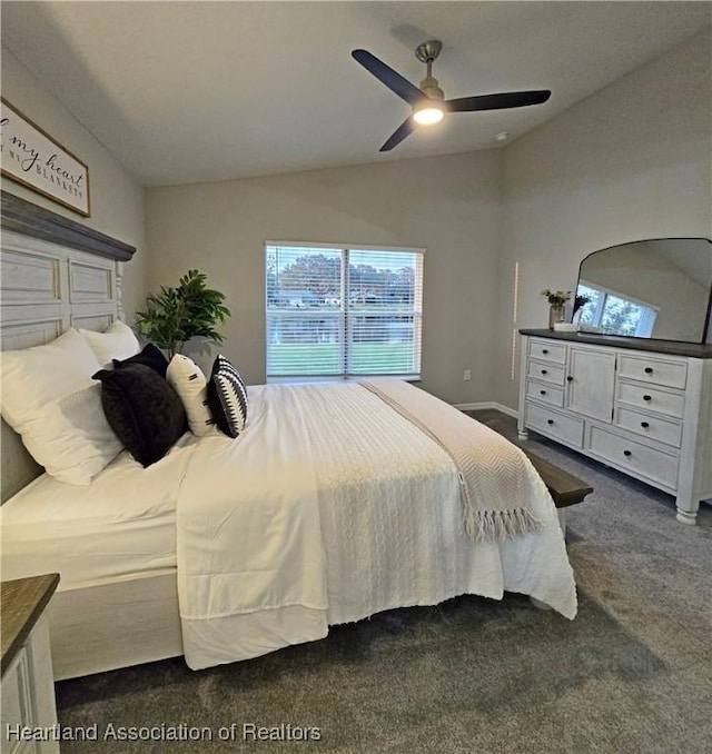 carpeted bedroom featuring ceiling fan and vaulted ceiling