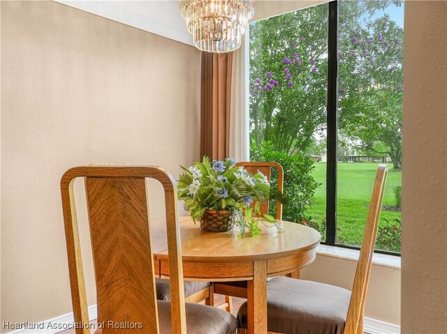 dining area featuring an inviting chandelier