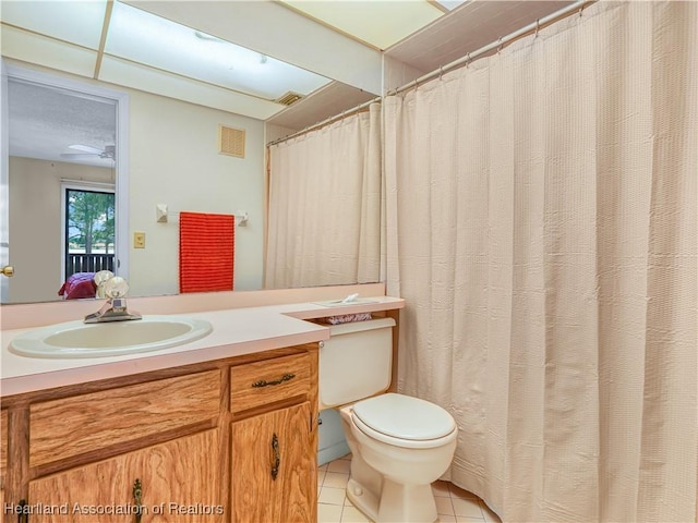 full bath featuring tile patterned flooring, visible vents, vanity, and toilet