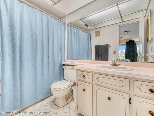 full bath with toilet, tile patterned flooring, visible vents, and vanity