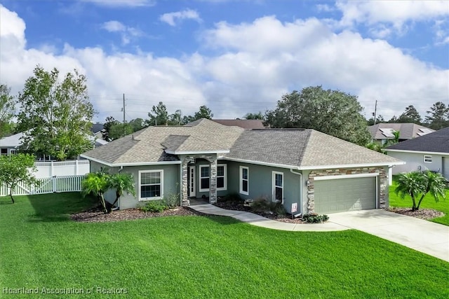 ranch-style home featuring a garage and a front lawn