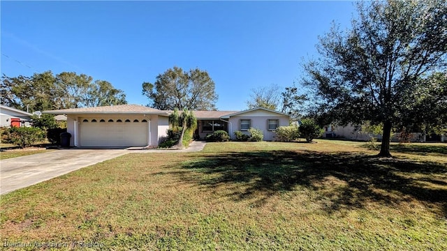 single story home featuring a front yard and a garage