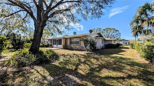 rear view of house with a yard