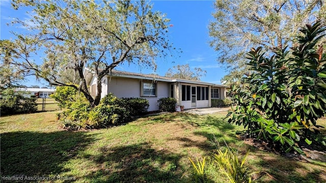 rear view of property with a lawn