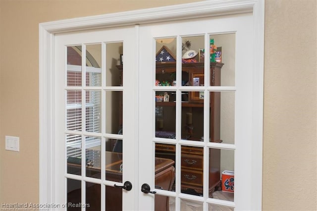 exterior details with french doors and stucco siding