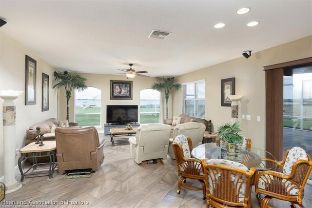 living room featuring recessed lighting, visible vents, and a ceiling fan