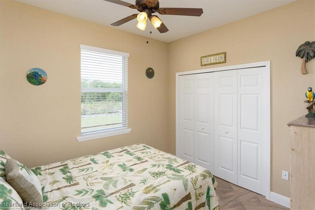 bedroom featuring a closet and ceiling fan