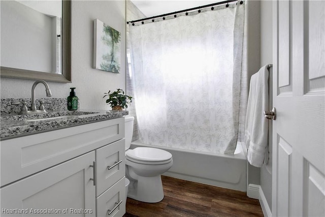 full bathroom with vanity, hardwood / wood-style floors, toilet, and shower / tub combo with curtain