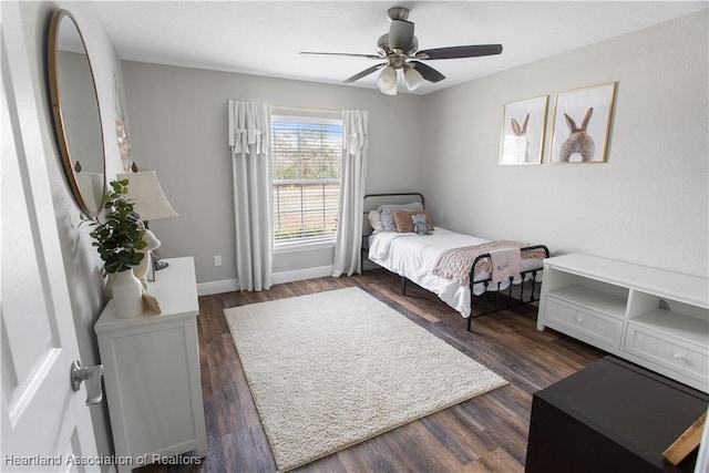 bedroom with dark wood-type flooring and ceiling fan