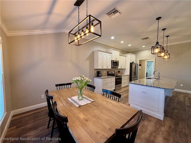 dining area with baseboards, visible vents, dark wood-style flooring, and ornamental molding