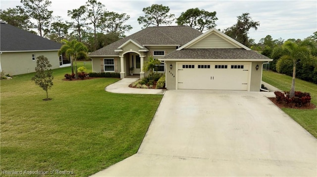 craftsman-style home with a garage, a front lawn, concrete driveway, and roof with shingles