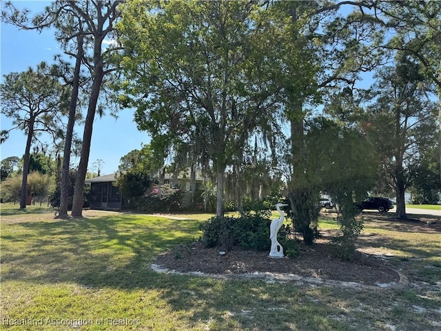 view of yard with a sunroom