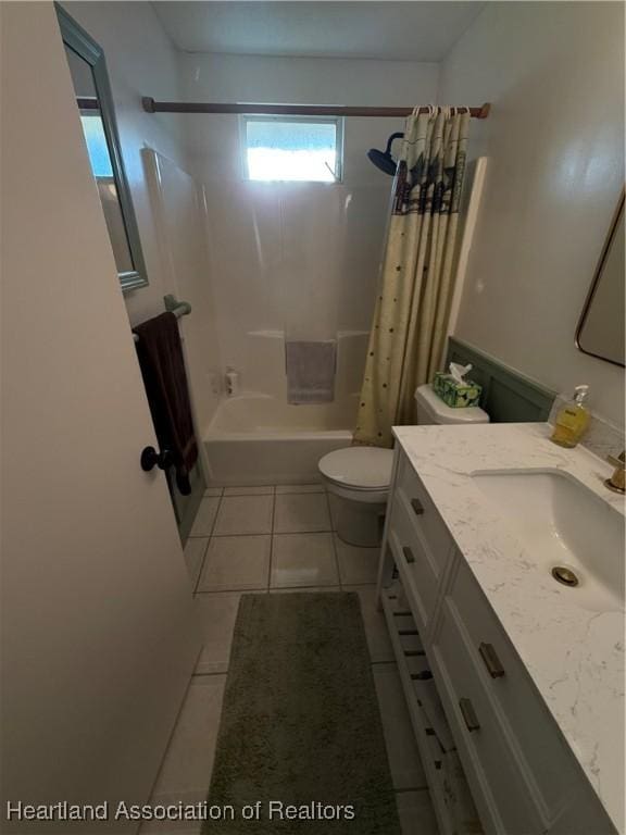 100 Daisy Ln, Lake Placid, FL 33852 - full bathroom with tile patterned floors, toilet, shower / bath combo, and vanity
