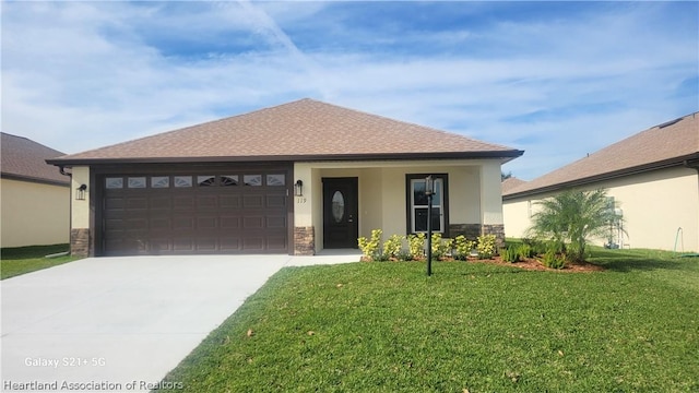 view of front facade with a garage and a front yard