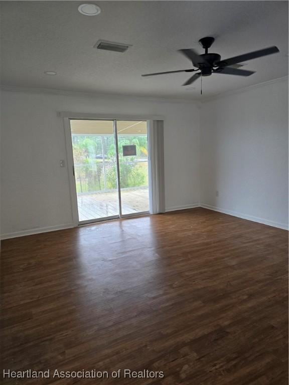 spare room featuring ornamental molding, ceiling fan, and dark hardwood / wood-style flooring