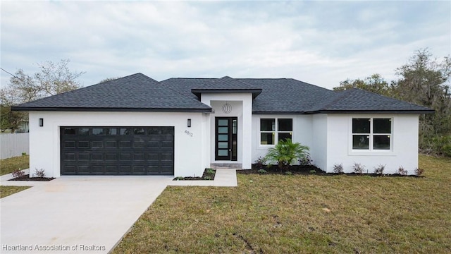 prairie-style house with a garage and a front yard