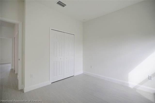 unfurnished bedroom featuring a closet