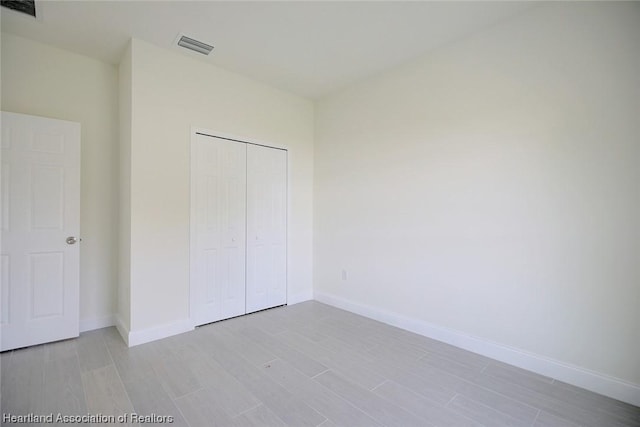 unfurnished bedroom with a closet