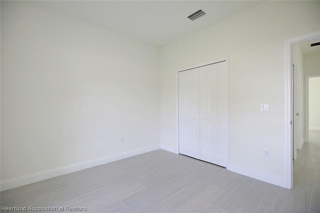 unfurnished bedroom with a closet