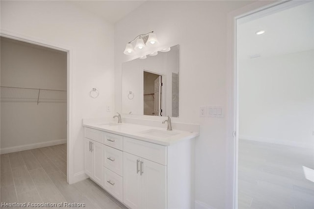 bathroom featuring hardwood / wood-style floors and vanity