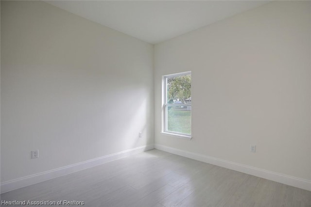 empty room with light wood-type flooring