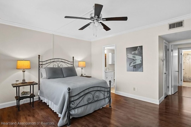 bedroom with dark hardwood / wood-style flooring, connected bathroom, ceiling fan, and ornamental molding