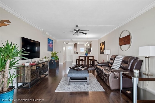 living room with crown molding, ceiling fan, and dark hardwood / wood-style floors