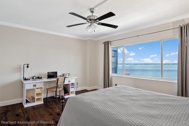 bedroom with crown molding, ceiling fan, and dark wood-type flooring