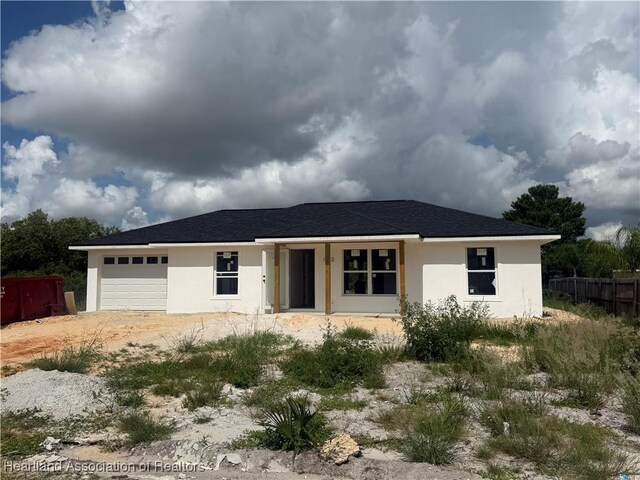 1512 Cedarbrook St, Lake Placid, FL 33852 - ranch-style home with an attached garage, stucco siding, and driveway