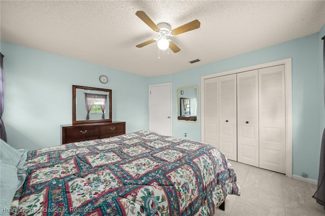 1536 Meadowbrook St, Lake Placid, FL 33852 - tiled bedroom featuring a closet, a ceiling fan, and a textured ceiling