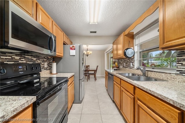 1536 Meadowbrook St, Lake Placid, FL 33852 - kitchen featuring appliances with stainless steel finishes, a sink, decorative backsplash, baseboards, and light tile patterned floors
