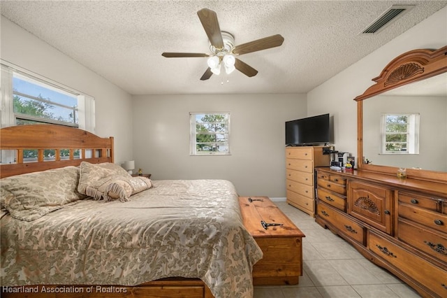 1536 Meadowbrook St, Lake Placid, FL 33852 - bedroom featuring multiple windows, a textured ceiling, light tile patterned floors, and ceiling fan