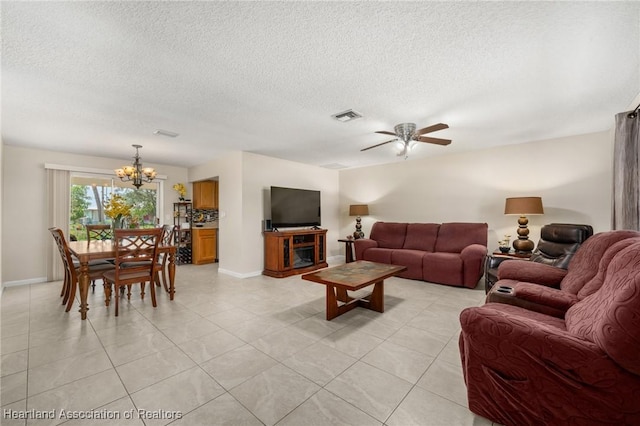 1536 Meadowbrook St, Lake Placid, FL 33852 - living area with a chandelier, a textured ceiling, ceiling fan, baseboards, and light tile patterned floors