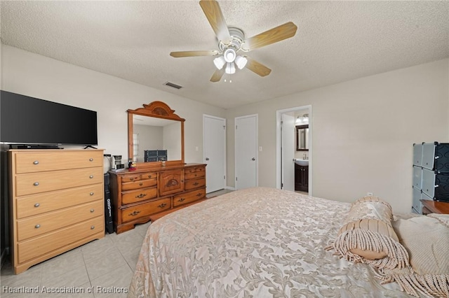 1536 Meadowbrook St, Lake Placid, FL 33852 - bedroom featuring light tile patterned floors, a textured ceiling, a ceiling fan, and ensuite bath