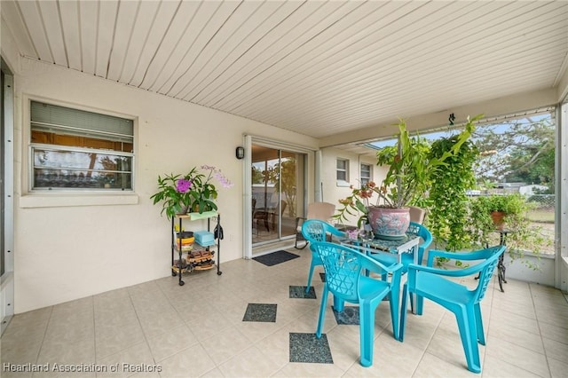 1536 Meadowbrook St, Lake Placid, FL 33852 - sunroom featuring outdoor dining area and tile patterned floors