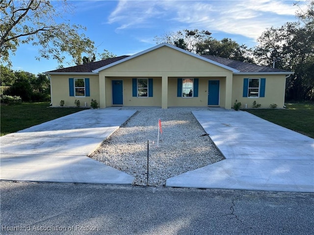 single story home with a porch and a front lawn