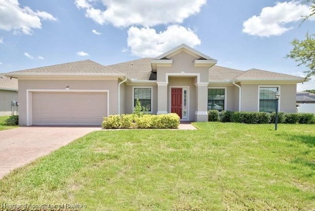 view of front facade featuring a garage and a front lawn