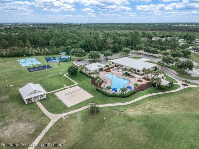 drone / aerial view featuring a view of trees